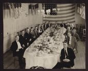 Men seated at table (veterans reunion)